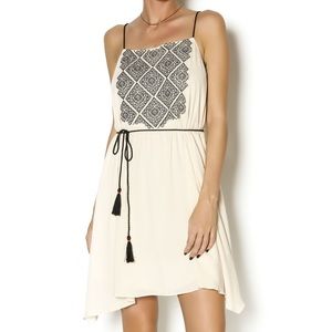 ISO AAKAA Cream mini dress with black tassels